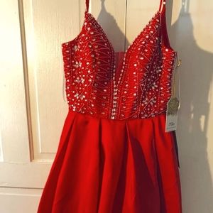 A red Macy's prom dress. It is size 11/12.
